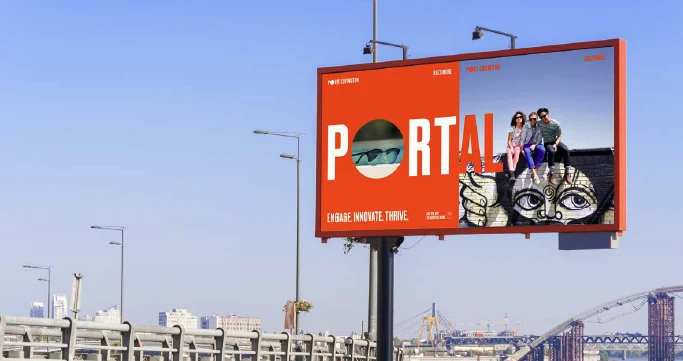 Highway billboard reading PORTAL with a photograph set into the O and a mural beside it: Engage. Innovate. Thrive.