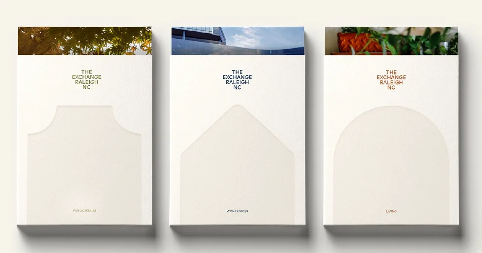 Three leasing folders: Public Realm, Workspaces and Living, each with a die-cut window