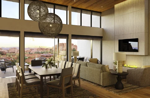 Rendering of a residence interior: a double-height great room with woven pendant lights, a long table, and red rock through the glass