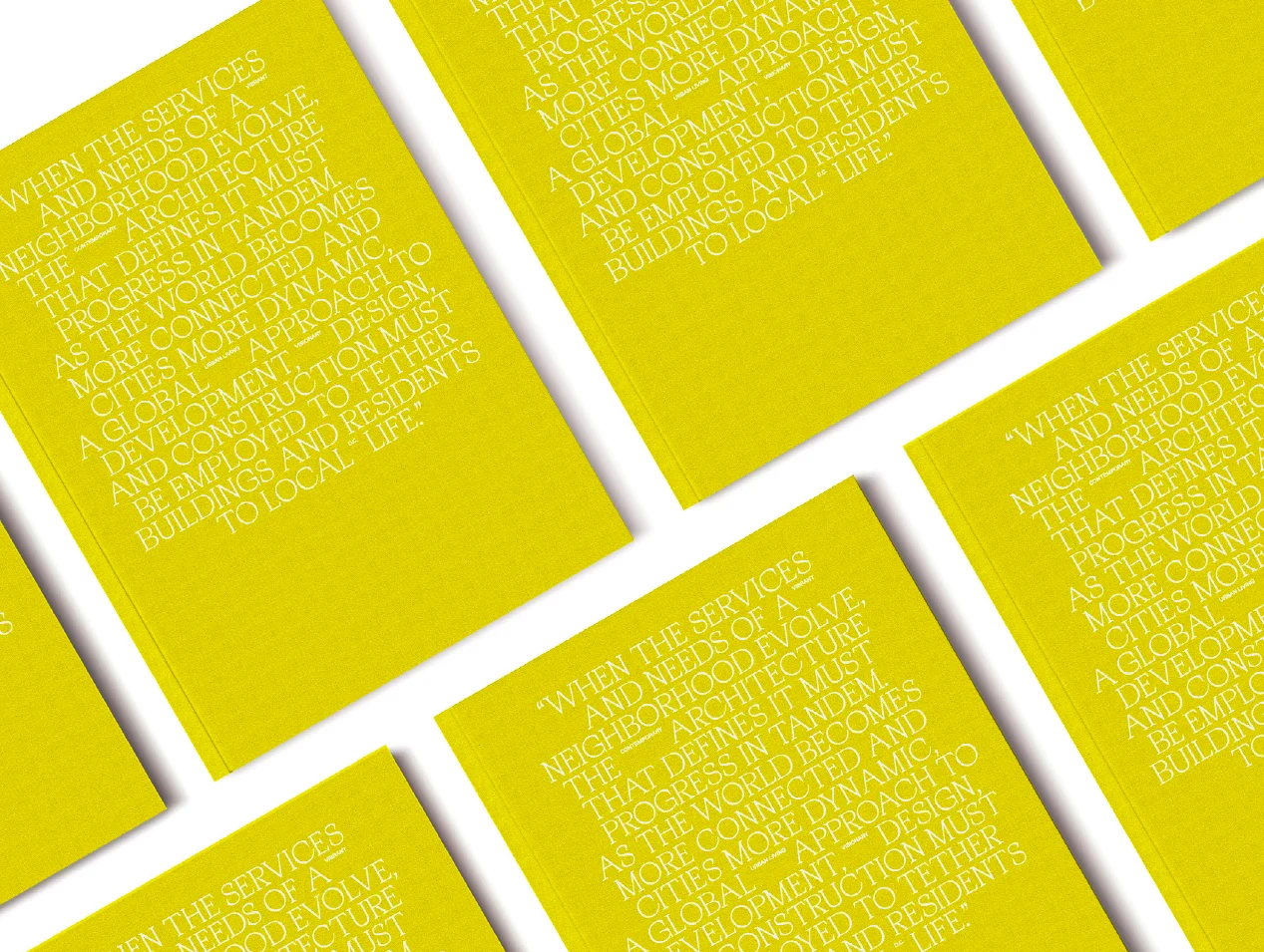 A grid of yellow brand books, each cover set in white serif capitals with a quotation about architecture and neighborhood